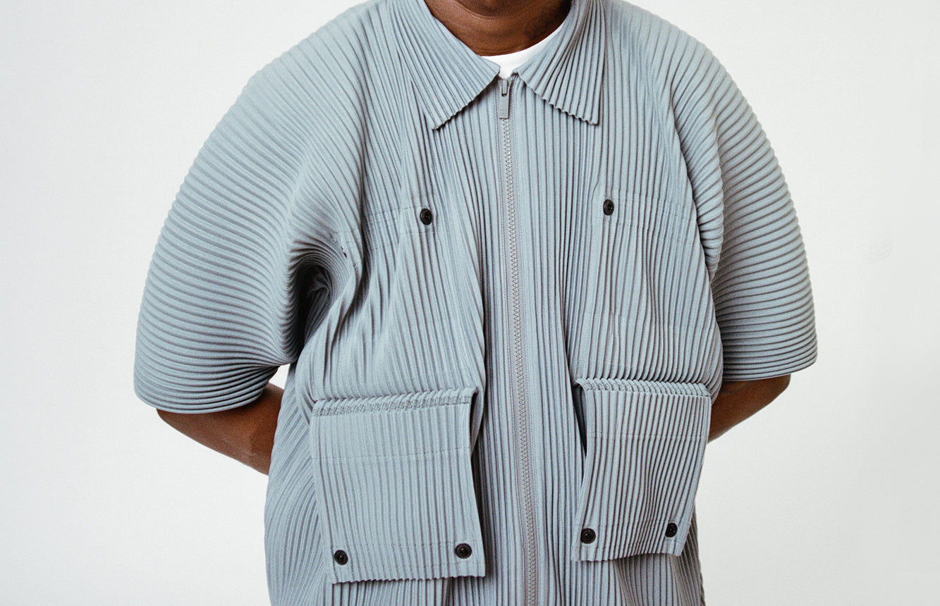 close up of a persons shirt with pleats and flaps
